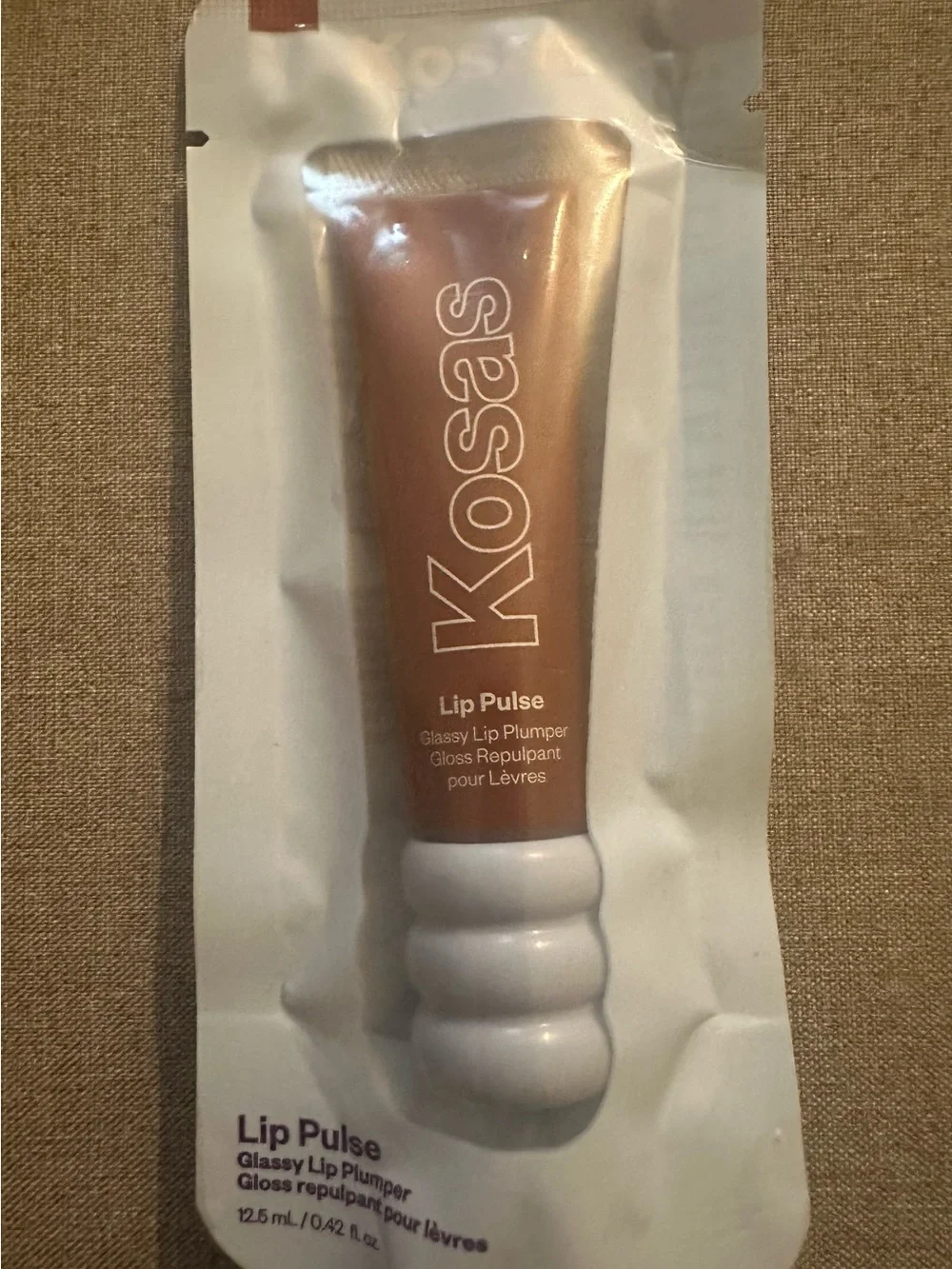 Kosas Sixth Sense Sheer Warm Beige Lip Plumper